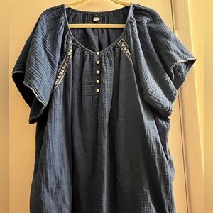 Blue top with white embroidery and buttons